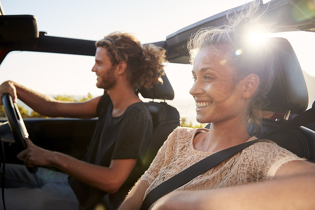 A couple out for a joy ride in their car