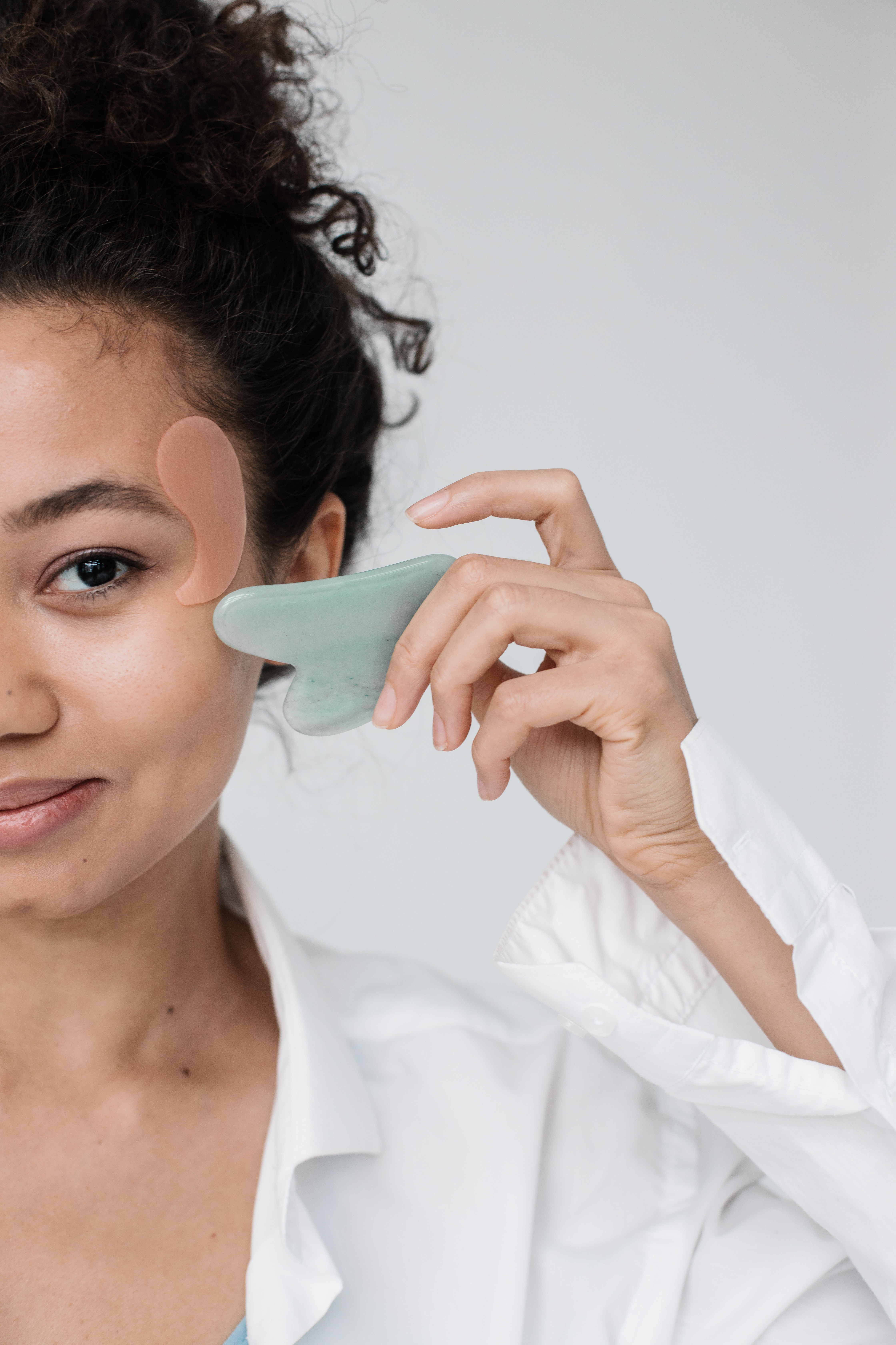 A Women with a Jade Gua Sha Stone