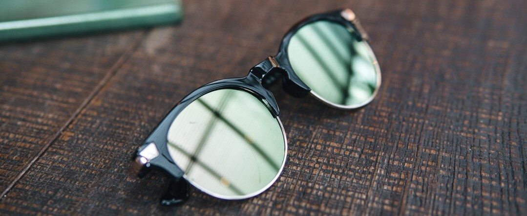 sunglasses on wooden table